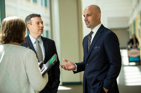 Brent Quimby (right) worked on the business proposal for a center for addiction medicine with his internship preceptor, Jason Lemire (left), practice manager for the Department of Orthopedics at Dartmouth-Hitchcock.
